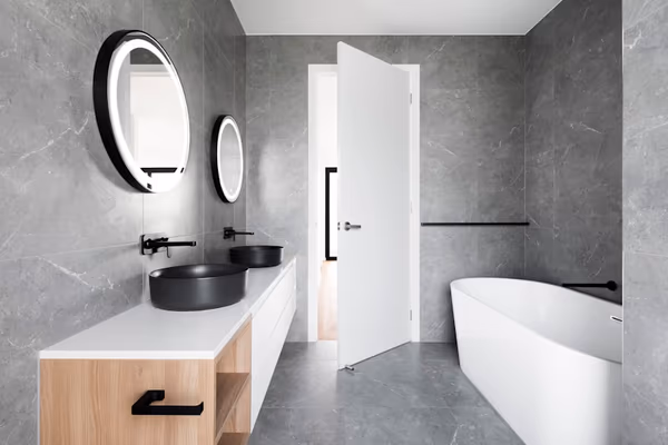 Freestanding bathtub remodel with modern fixtures in a luxury bathroom