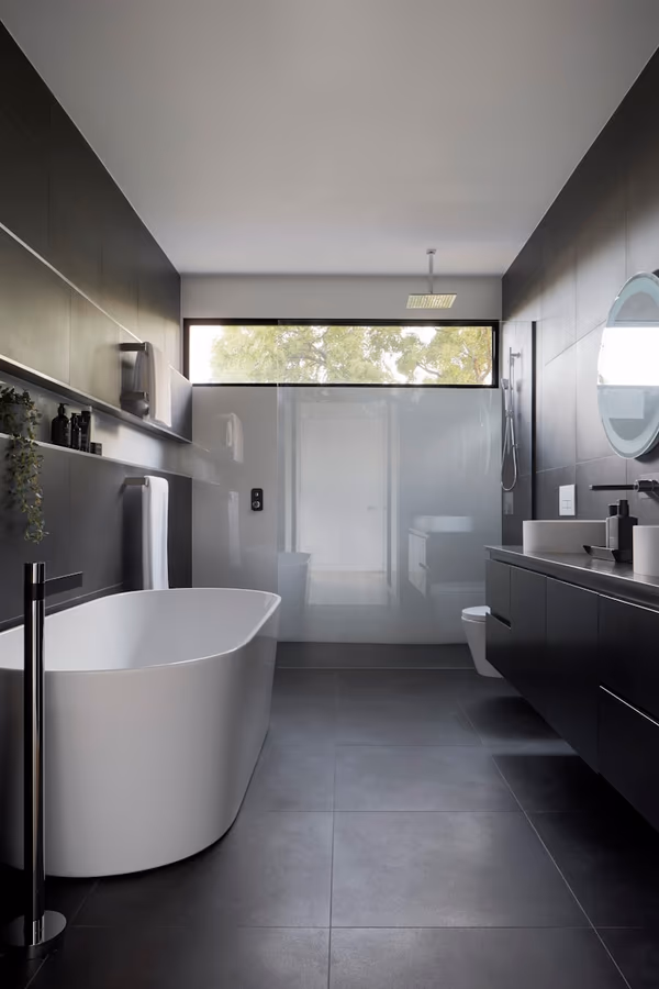 Handicap accessible bathroom with grab bars and curbless shower entry